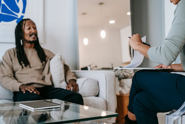 A tenant speaking with a landlord and going through a rental application