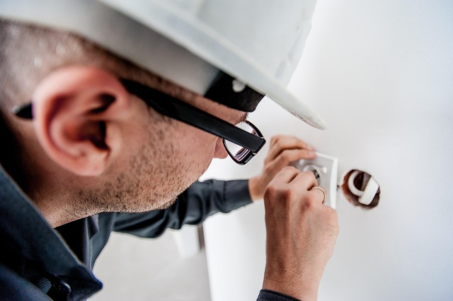 Maintenance man checking a plug
